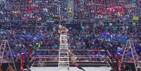 Zayn pushes over Sin Cara on ladder.gif