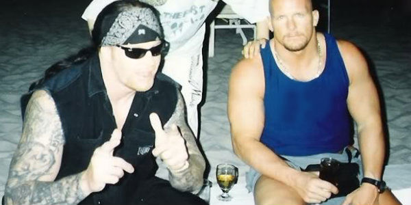 Stone Cold Steve Austin WWE Unsigned Stunner on Undertaker Photograph