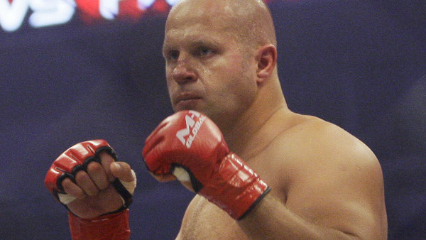 FILE - In this June 26, 2010, file photo, Fedor Emelianenko, of Russia, fights Fabricio Werdum in a Strikeforce/M-1 Global mixed martial arts match in San Jose, Calif. Emelianenko doesn't speak a lick of English. He rarely smiles. When he steps inside