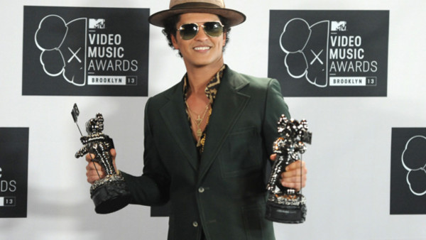 Bruno Mars poses backstage with the award for Best Male Video for 