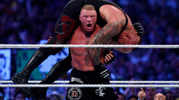 The Undertake, top, and Brock Lesnar, bottom, compete during Wrestlemania XXX at the Mercedes-Benz Super Dome in New Orleans on Sunday, April 6, 2014. (Jonathan Bachman/AP Images for WWE)