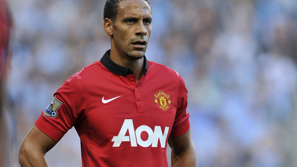 FILE - A Sunday, Sept. 22, 2013 photo from files showing Manchester United's Rio Ferdinand during their English Premier League soccer match against Manchester City at the Etihad Stadium in Manchester, England. Rio Ferdinand says he is leaving Manchest