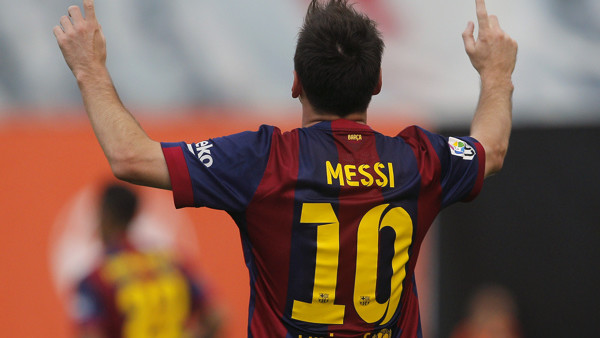 Barcelona's Lionel Messi celebrates his goal during a Spanish La Liga soccer match between Rayo Vallecano and FC Barcelona at the Vallecas stadium in Madrid, Spain, Saturday, Oct. 4, 2014. (AP Photo/Andres Kudacki)