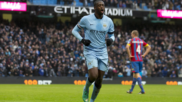Manchester City's Yaya Toure celebrates after scoring against Crystal Palace during the English Premier League soccer match between Manchester City and Crystal Palace at the Etihad Stadium, Manchester, England, Saturday Dec. 20, 2014. (AP Photo/Jon Su