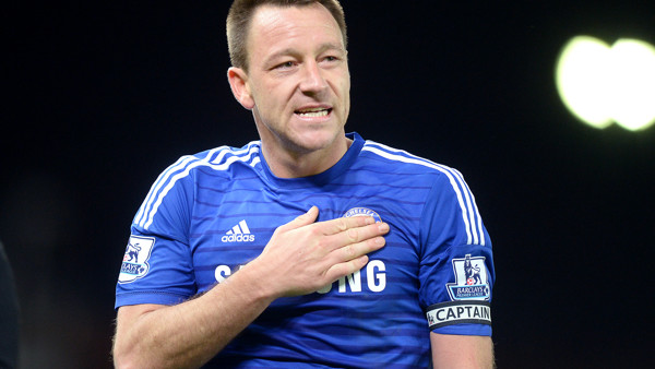 Chelsea's John Terry touches the badge on his chest after the Barclays Premier League match at the Britannia Stadium, Stoke.