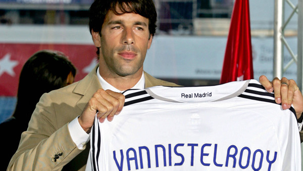 Ruud van Nistelrooy of the Netherlands holds up his new Real Madrid shirt during his official presentation at the Bernabeu stadium in Madrid, Friday, July 28, 2006. Van Nistelrooy, formerly of Manchester United, is Real Madrid's third signing since Ramon 