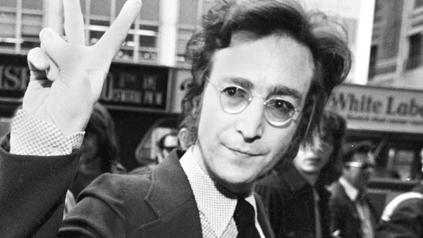 **FILE**Former Beatle John Lennon, giving the peace sign, and his wife, Yoko Ono, arrive for a hearing on their deportation case at U.S. Immigration and Naturalization Service office in lower Manhattan, on May 12, 1972. The ex-Beatle's celebrated batt