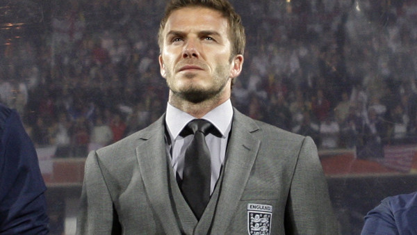 Soccer player David Beckham stands by the English bench prior to the World Cup group C soccer match between England and the United States at Royal Bafokeng Stadium in Rustenburg, South Africa, Saturday, June 12, 2010. (AP Photo/Bernat Armangue)
