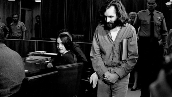 Charles Manson walks into the courtroom in Santa Monica, Ca. on Oct. 13, 1970. Manson and Susan Atkins, seated, a member of his family of followers, are to plead on charges of murdering a Malibu musician, Gary Hinman. When his name was called, Manson stoo