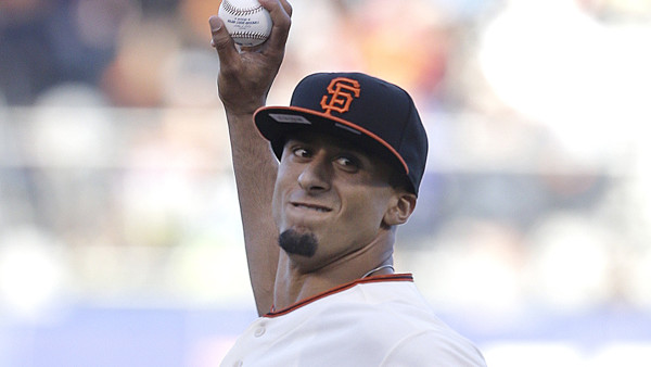 San Francisco 49ers quarterback Colin Kaepernick throws the ceremonial first pitch before a baseball game between the San Francisco Giants and the Miami Marlins in San Francisco, Friday, June 21, 2013. (AP Photo/Jeff Chiu)
