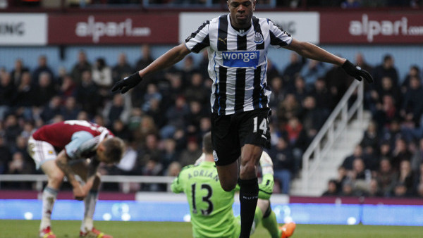 Newcastle United's Loic Remy celebrates his goal against West Ham United during their English Premier League soccer match at Upton Park, London, Saturday, Jan. 18, 2014. (AP Photo/Sang Tan)