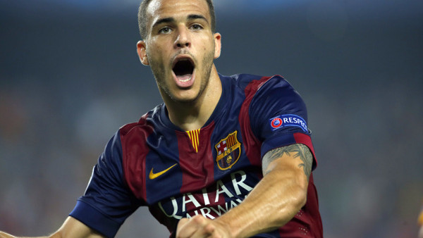 Barcelona's Sandro Ramirez celebrates after scoring his side's 3rd goal during the Champions League group F soccer match between F.C. Barcelona and Ajax at Camp Nou stadium in Barcelona, Spain, Tuesday, Oct. 21, 2014. Barcelona defeated Ajax 3-1. 