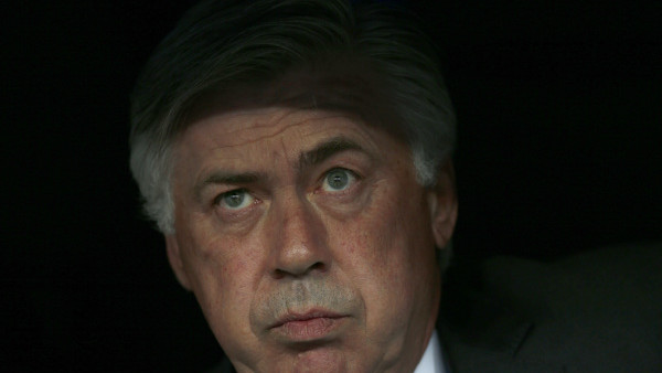 Real Madrid's coach Carlo Ancelotti watches from the dugout during the Champions League second leg semifinal soccer match between Real Madrid and Juventus, at the Santiago Bernabeu stadium in Madrid, Wednesday, May 13, 2015. (AP Photo/Daniel Ochoa de Olza