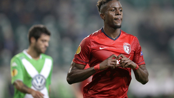 LOSC Lille's Divock Origi, right, celebrates after scoring his side's first goal during the Europa League Group H soccer match between VfL Wolfsburg and LOSC Lille at the Volkswagen Arena stadium in Wolfsburg, Germany, Thursday, Oct. 2, 2014. (AP Photo/Mi