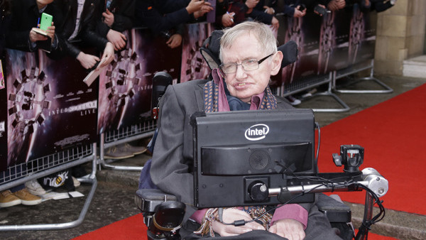 Professor Stephen Hawking poses for photographers upon arrival for the Interstellar Live show at the Royal Albert Hall in central London, Monday, 30 March, 2015. Christopher Nolans film will be shown on the big screen, whilst composer Hans Zimmer leads a 