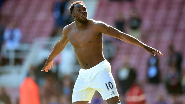 Everton's Romelu Lukaku celebrates with his shirt off after the game.