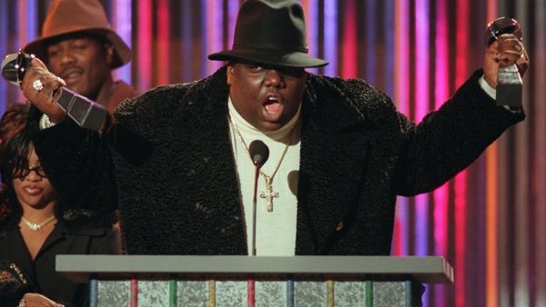 **FILE** The family of rapper Notorious B.I.G., shown clutching his awards at the Billboard Music Awards in New York, on Dec. 6, 1995, has asked a Los Angeles judge for permission to expand their wrongful-death lawsuit against the city of Los Angeles. Not