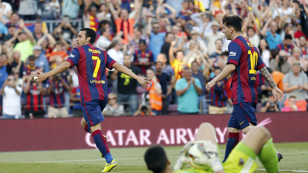 FC Barcelona's Pedro Rodriguez, left, reacts after scoring against Real Sociedad during a Spanish La Liga soccer match at the Camp Nou stadium in Barcelona, Spain, Saturday, May 9, 2015. (AP Photo/Manu Fernandez)
