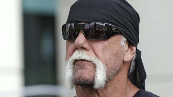 FILE - In this Oct. 15, 2012, file photo, reality TV star and former pro wrestler Hulk Hogan, whose real name is Terry Bollea, looks on as his attorney speaks during a news at the United States Courthouse in Tampa, Fla. Hogan is suing Gawker for invasion 