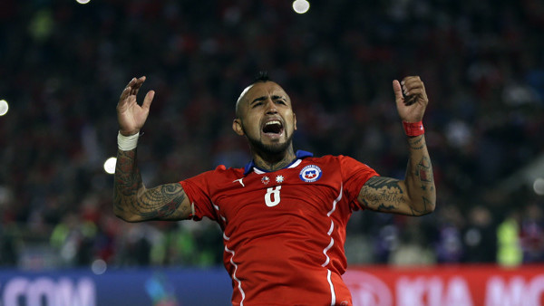 Chile's Arturo Vidal celebrates after scoring a penalty during penalty shootout at the Copa America final soccer match against Argentina at the National Stadium in Santiago, Chile, Saturday, July 4, 2015. Chile won the Copa America on penalty shootout