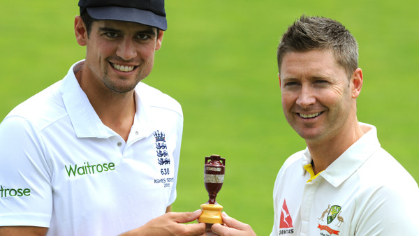 England captain Alastair Cook, left, and Australia captain Michael Clarke pose with the Ashes Trophy ahead of the first Ashes Test match, in Cardiff, Wales, Tuesday, July 7, 2015. (AP Photo/Rui Vieira)