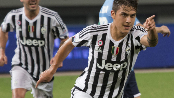 Juventus' Paulo Dybala, at right, celebrates after scoring against Lazio during the 2015 TIM Italian Supercup held at the Shanghai Stadium in Shanghai, China, Saturday, Aug. 8, 2015. Juventus defeated Lazio 2-0 to win the Supercup. (AP Photo/Ng Han Gu