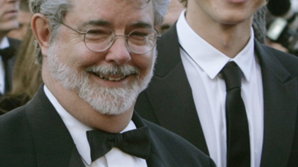 American director George Lucas, left, and Canadian actor Hayden Christensen, right, smile as they arrive for the screening of