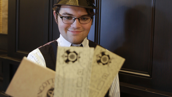 Dimitri Abbondandolo holds up various denominations of currency that can be purchased The Gringnotts Exchange during a preview of Diagon Alley at the Wizarding World of Harry Potter at Universal Orlando, Thursday, June 19, 2014, in Orlando, Fla. (AP Photo