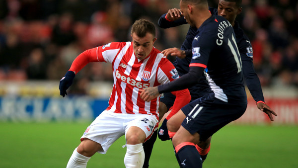 Stoke City's Xherdan Shaqiri (left) and Newcastle United's Yoan Gouffran (right) battle for the ball during the Barclays Premier League match at the Britannia Stadium, Stoke-on-Trent.