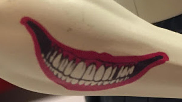 Joker Arm Smile Tattoo