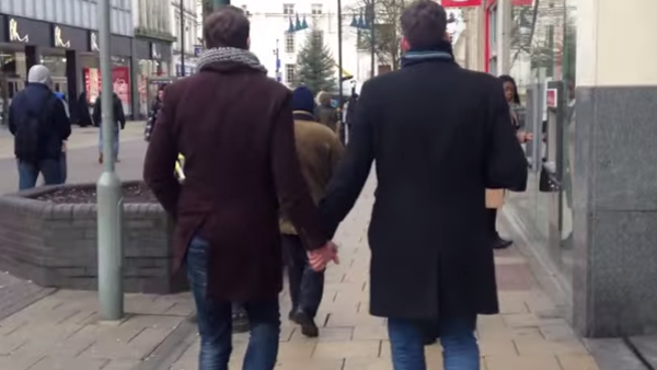 Two gay men holding hands