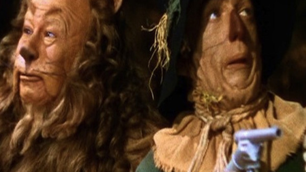 scarecrow with a gun in wizard of oz