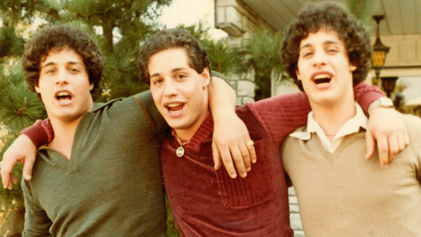 Three Identical Strangers