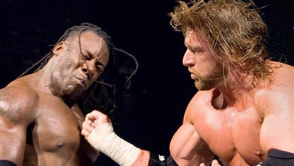 Booker T (w/ Kevin Nash) (c) vs. Triple H (w/ Ric Flair) for the World Heav...