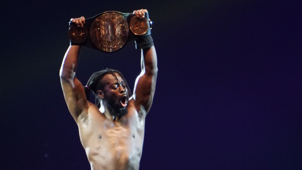 Kofi Kingston celebrates with Tag Team Championship belt